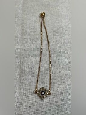 Gold Tone & Crystal Evil Eye Pendant Bracelet.